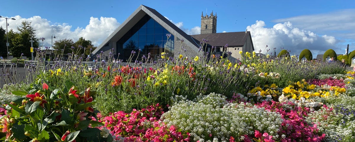 Church with gardens in foreground