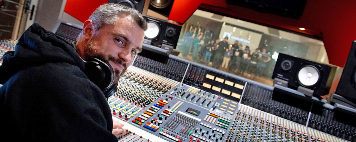 Technician at mixing deck in the studio