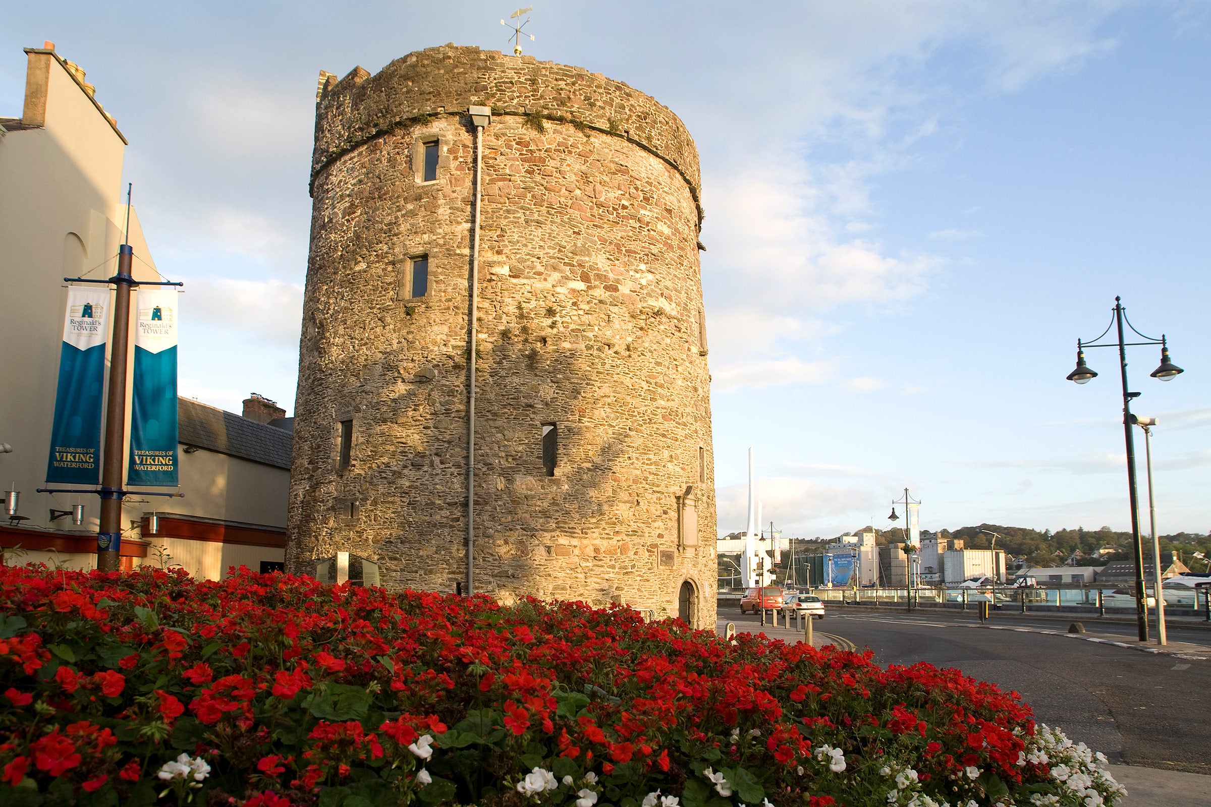 Flowers in a bed outside the exterior of Reginald's Tower in Waterford
