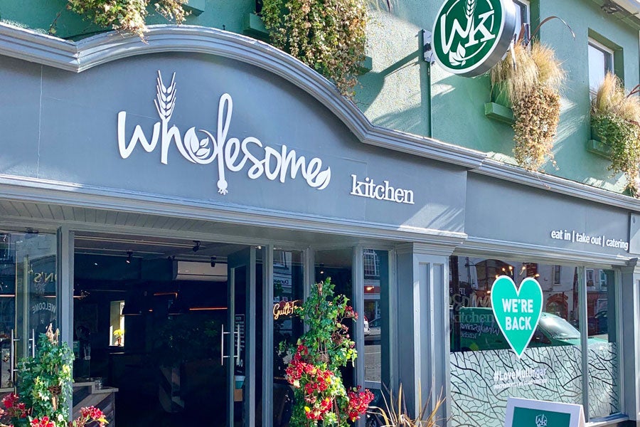 A view of the front door and entrance to the Wholesome Kitchen