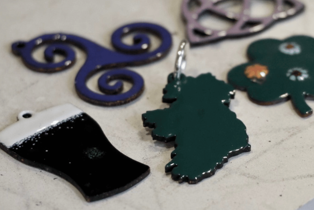 Introduction to Enamel Workshop, different enamel shapes ie a map of Ireland, a shamrock, a pint of Guinness.