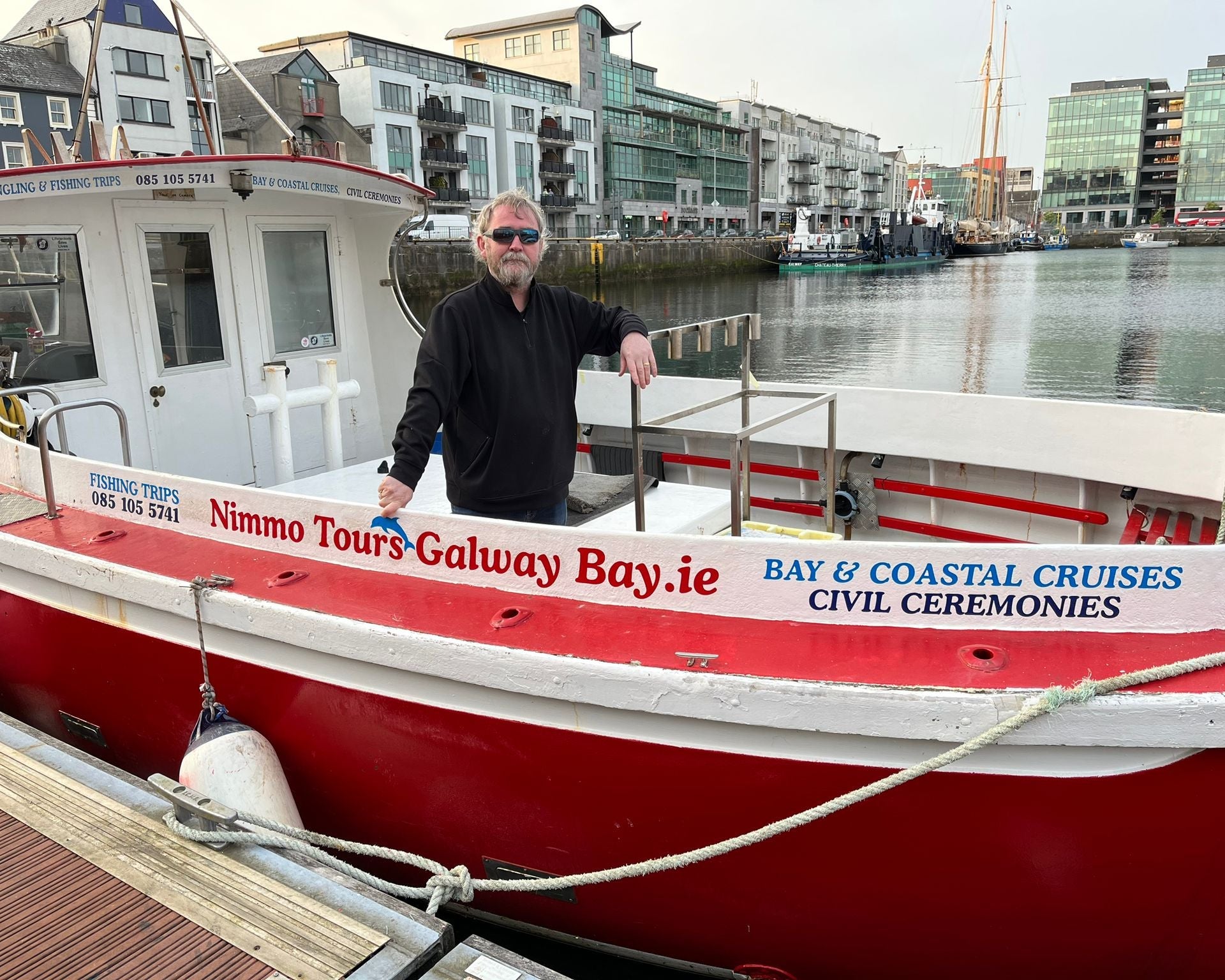 The skipper onboard the Nimmo Tours Galway Tours boat docked in Galway City
