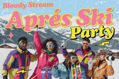 a group of people dressed in brightly coloured ski wear having fun with snowy mountains in background.