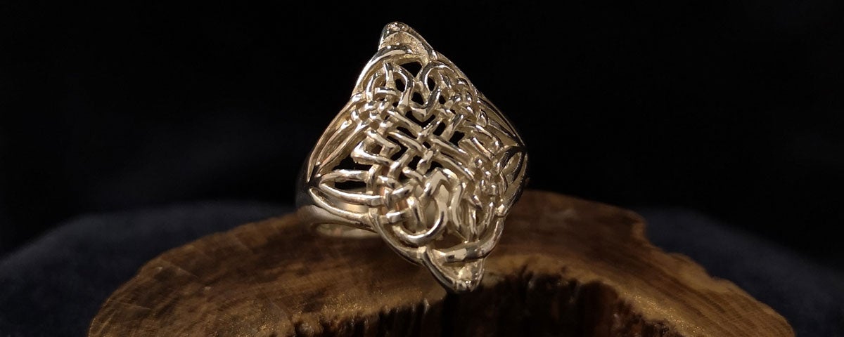 Silver design ring by Kinsale Silver on wooden display