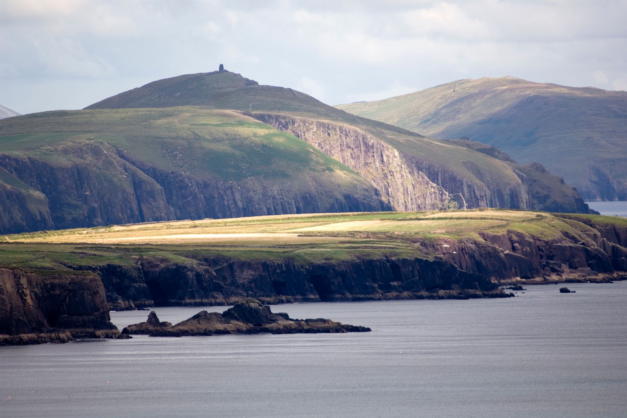 A calm sea surrounding the Dingle Peninsula in County Kerry