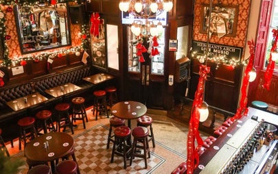 Interior of a bar with high stools and tables