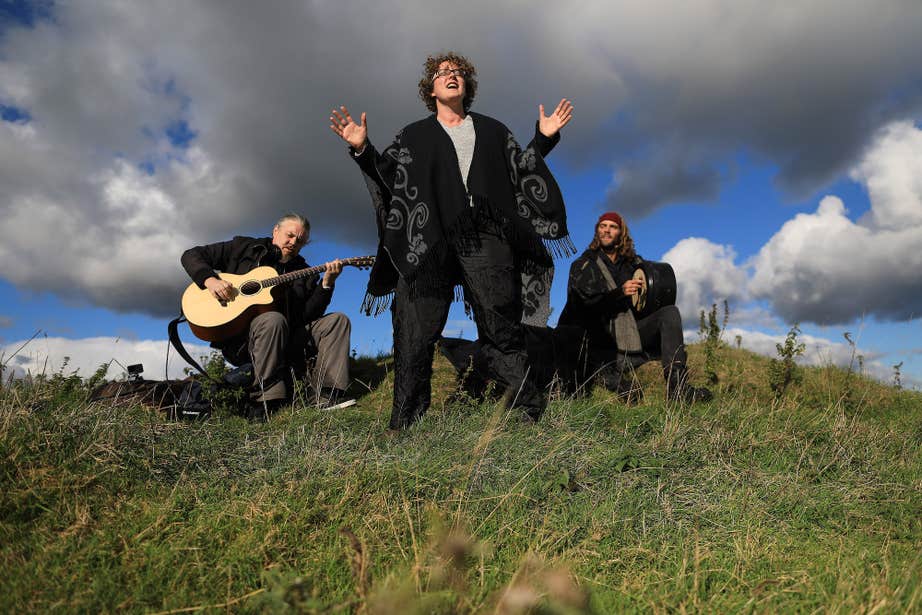 Aron and Sorcha Hegarty and their guitarist performing the Candlelit Tales at the Púca Festival in County Meath in 2022.