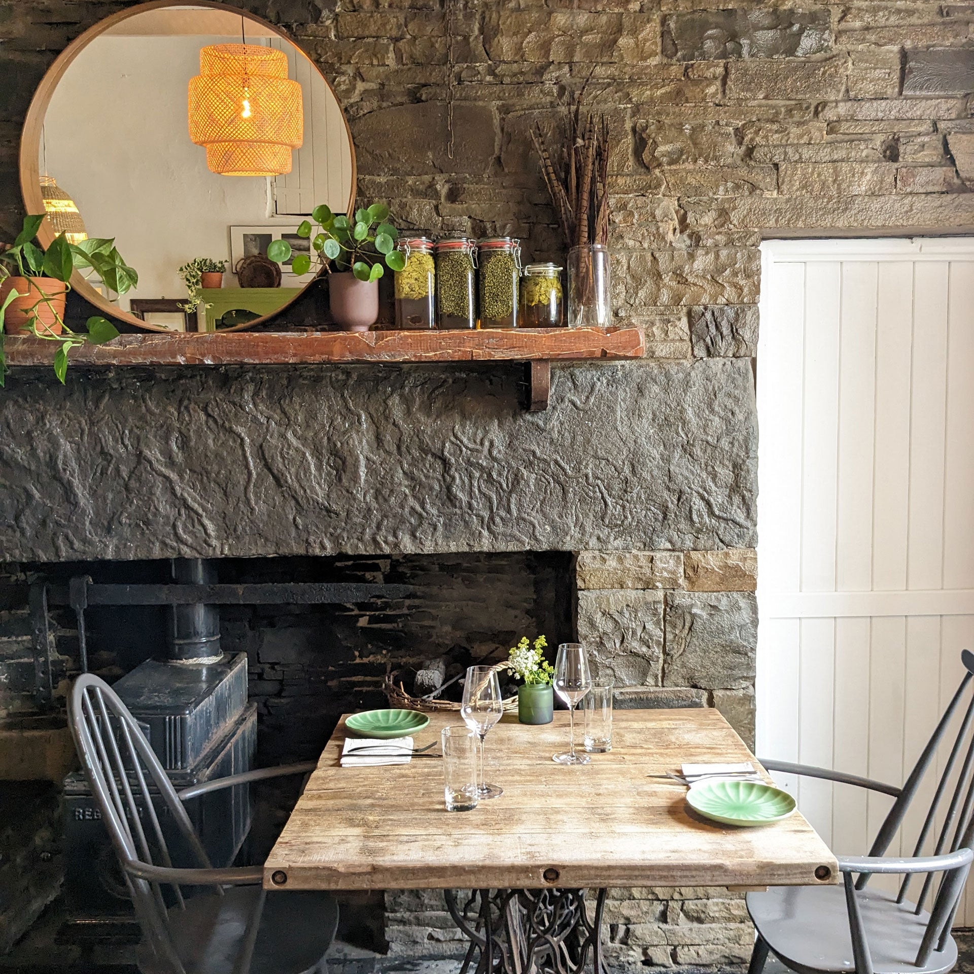 Homestead Cottage Doolin interior table by a fireplace