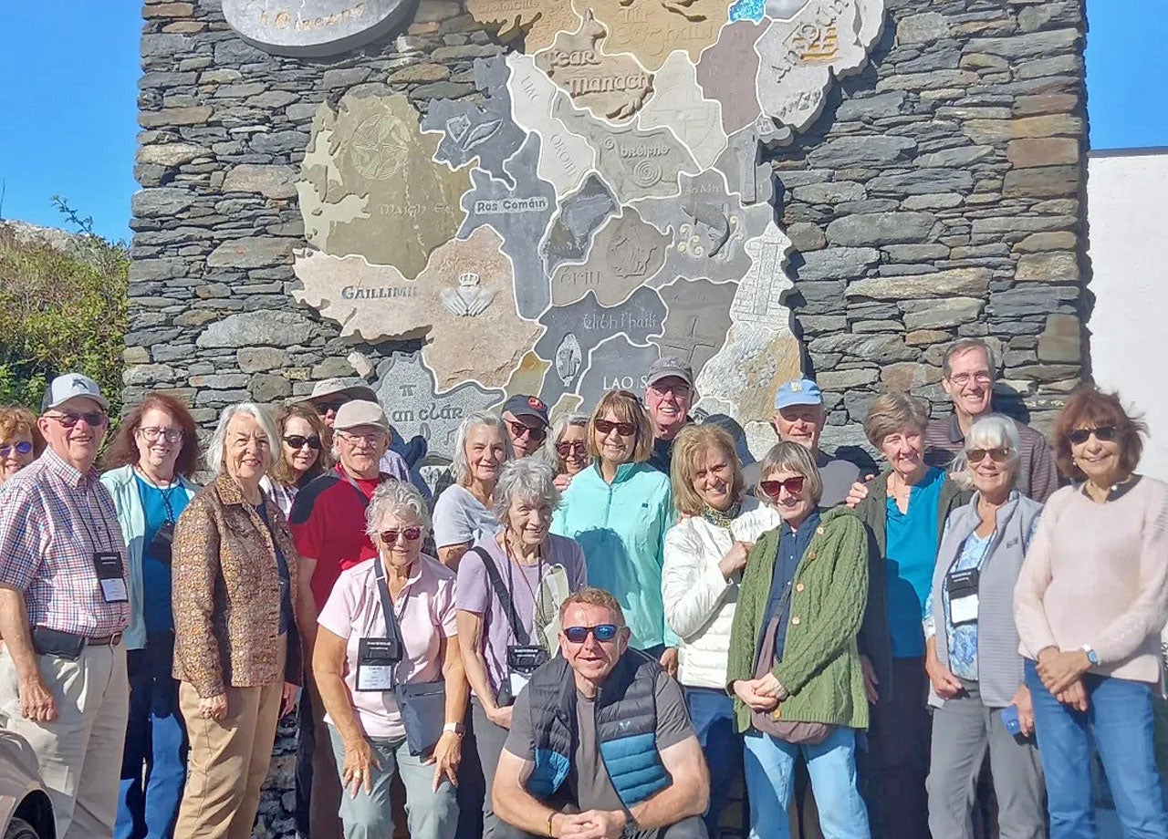 Galway Trails group in front of a stone map of Ireland in County Donegal