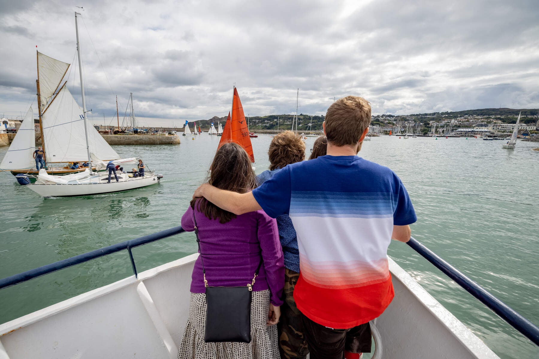 Family looking out on Dublin Bay from boat.