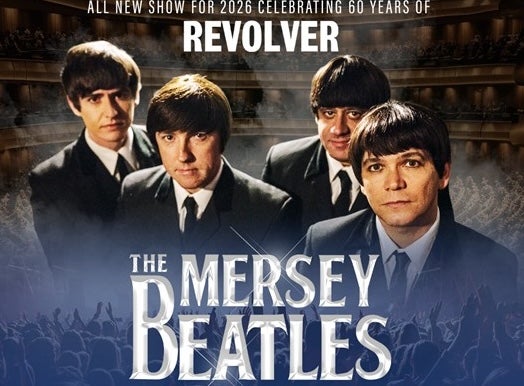 4 men in dark suits and ties looking slightly upwards as camera