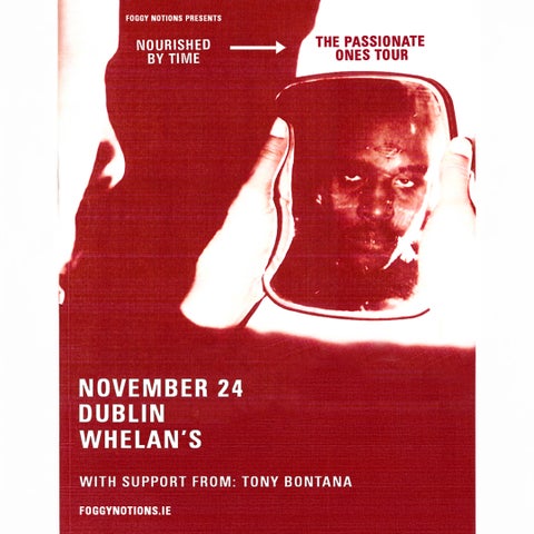 Dark red and white abstract image of to hands holding object with reflection of a man's face in.