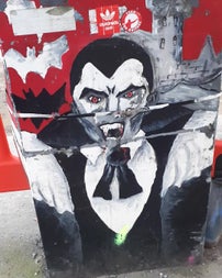 A vivid street art mural of Count Dracula, fangs bared and cape spread, painted on a utility box in Dublin — a colourful nod to the city's gothic legacy and Bram Stoker's most famous creation.