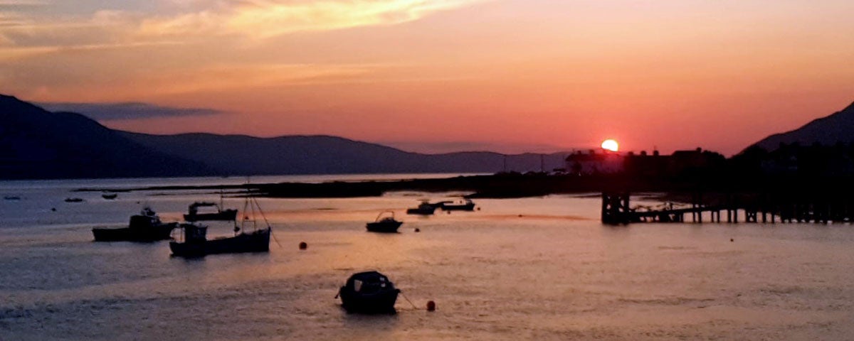 Boats on the water at sunset on Carlingford Lough