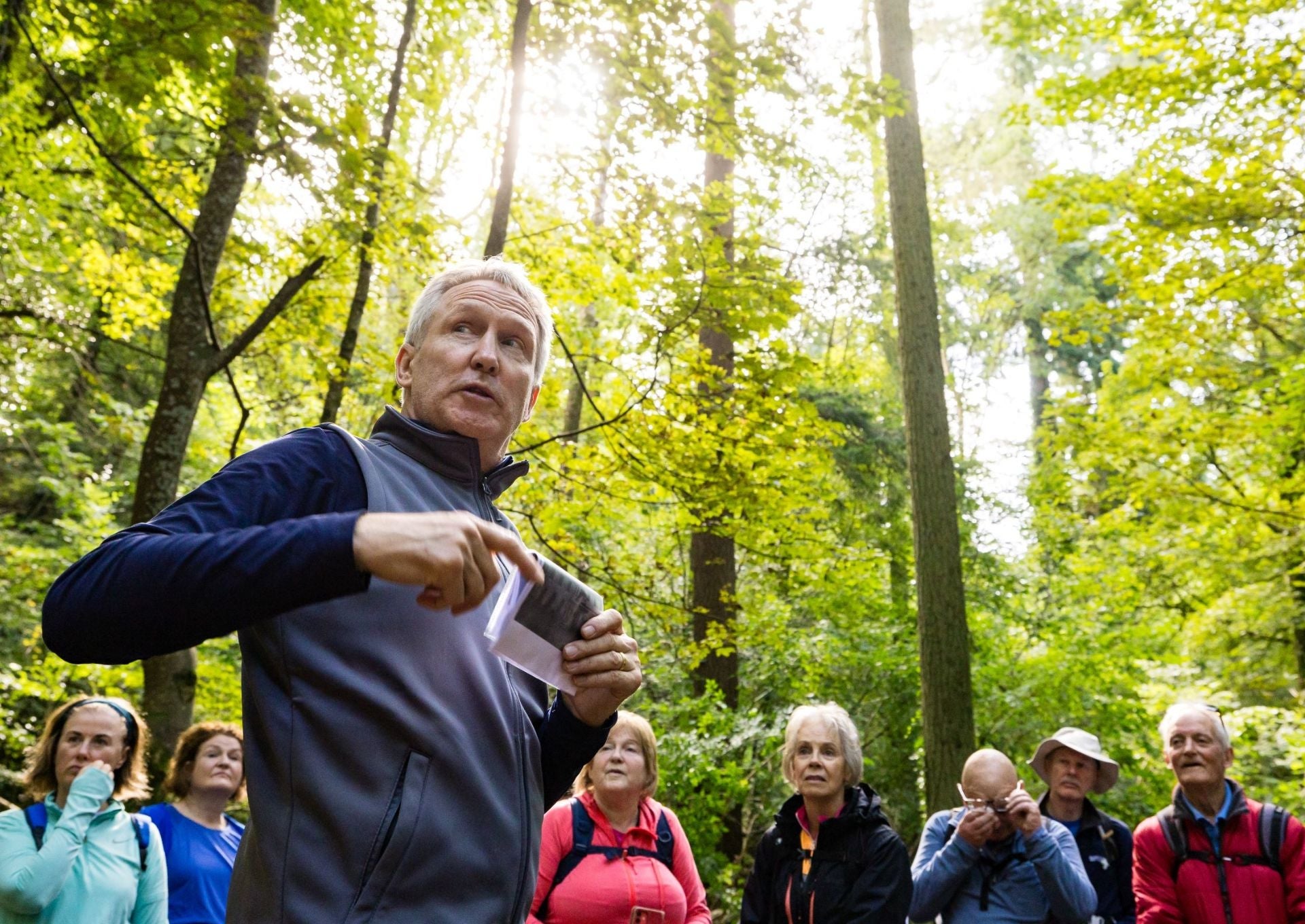 A group of people on a tour in the woods with Boyne Valley Trails