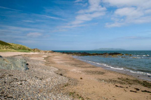 Views of the long sandy beach and sea at Donabate Balcarrick Beach