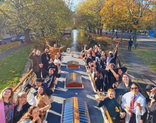 Group of passengers on the deck of a canal boat