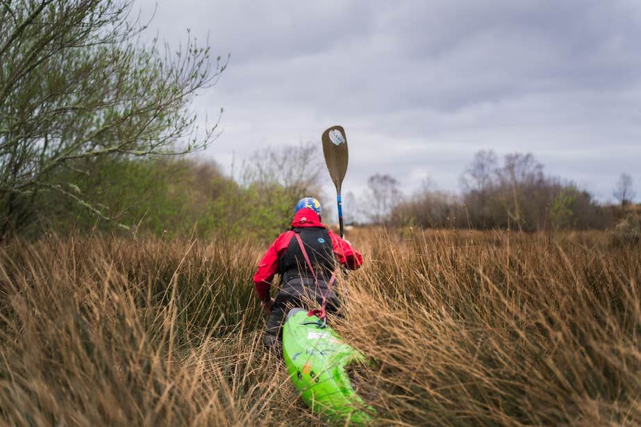 Kayaking sometimes means battling the brush.