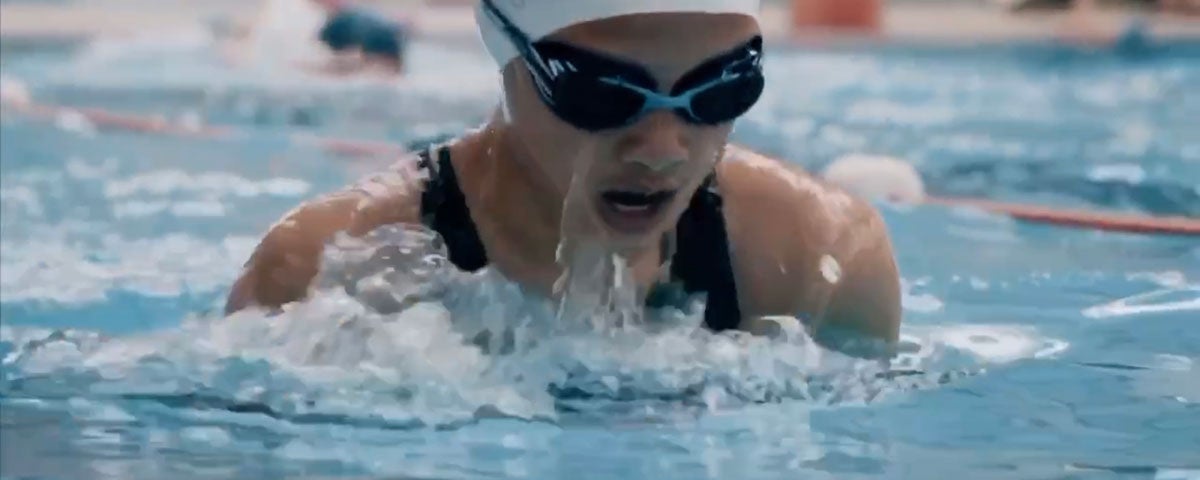 A person wearing goggles swimming in Coral Leisure Cobh swimming pool