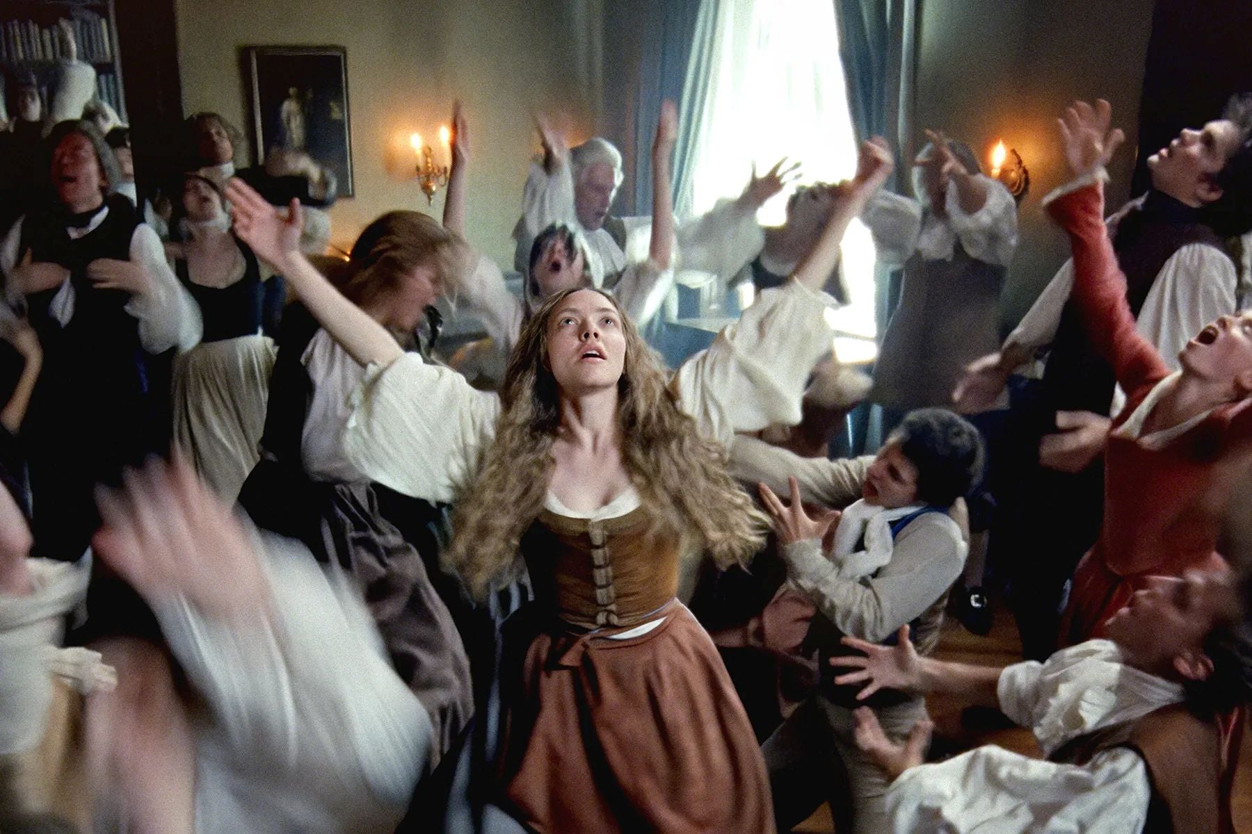 People in 18th Century clothing are dancing wildly.