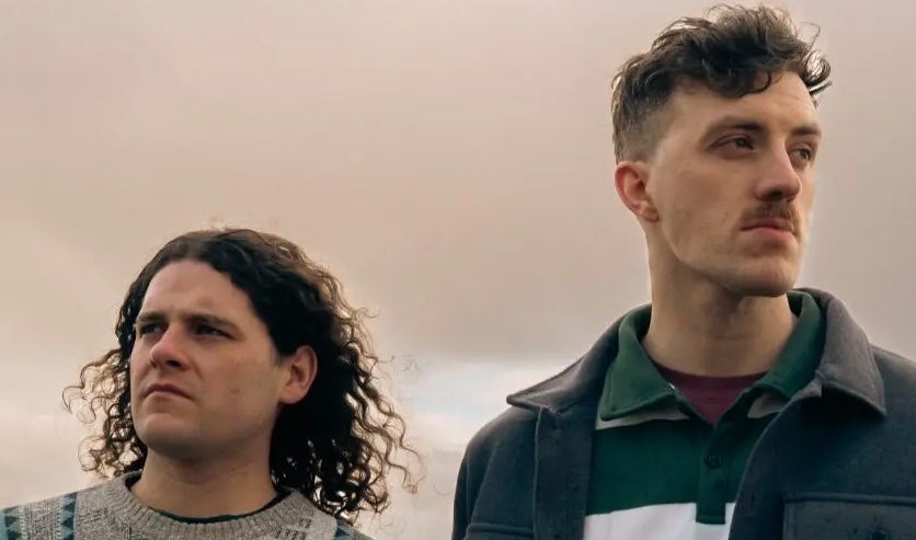 2 men looking into the distance