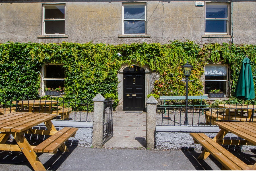 Entrance to accommodation with ivy frontage