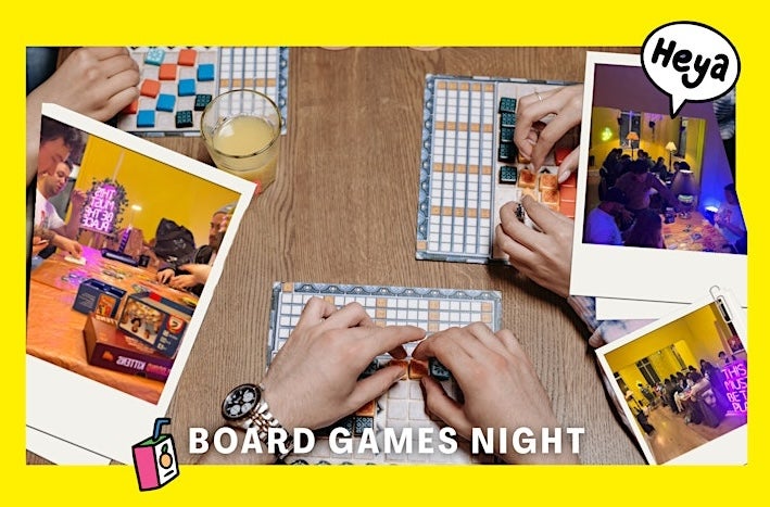 Looking down at hands on a table playing board games.