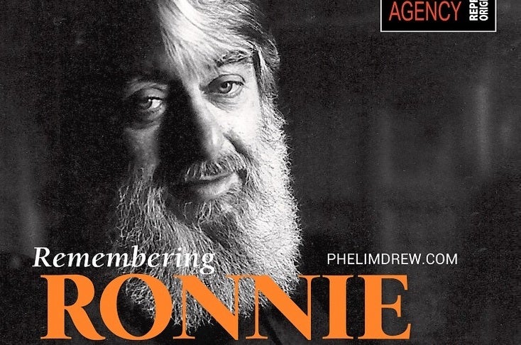 "Remembering Ronnie" with Phelim Drew, headshot of smiling man with bushy beard.