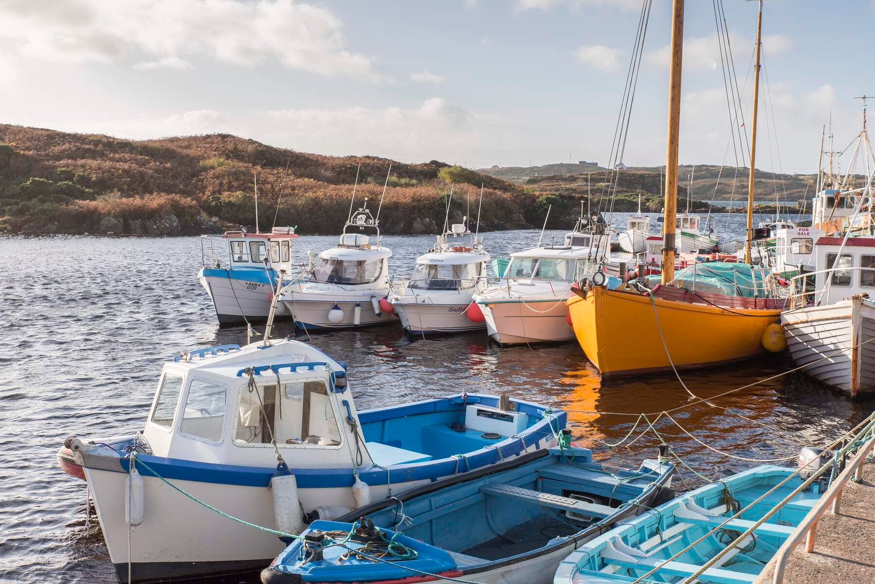 View of boats sitting in Bunbeg Harbour.