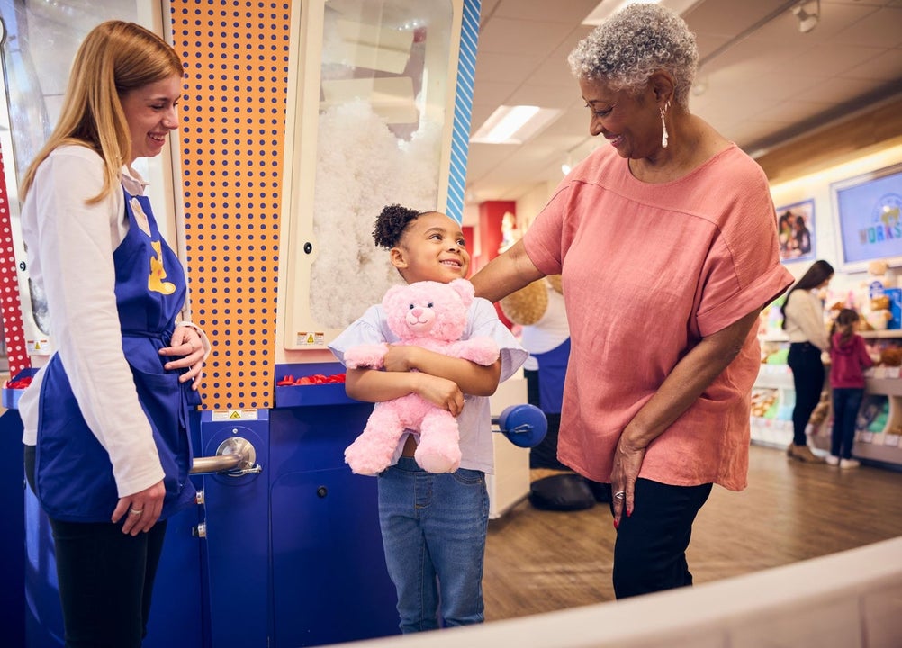 A happy child with their new teddy bear
