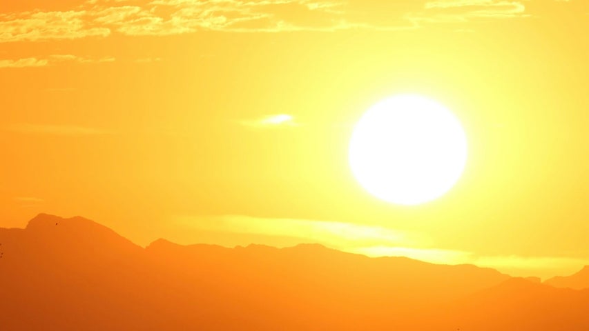 An image depicting a sun low in the sky at evening