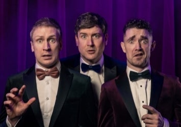 3 startled looking men in evening suits and bow ties.