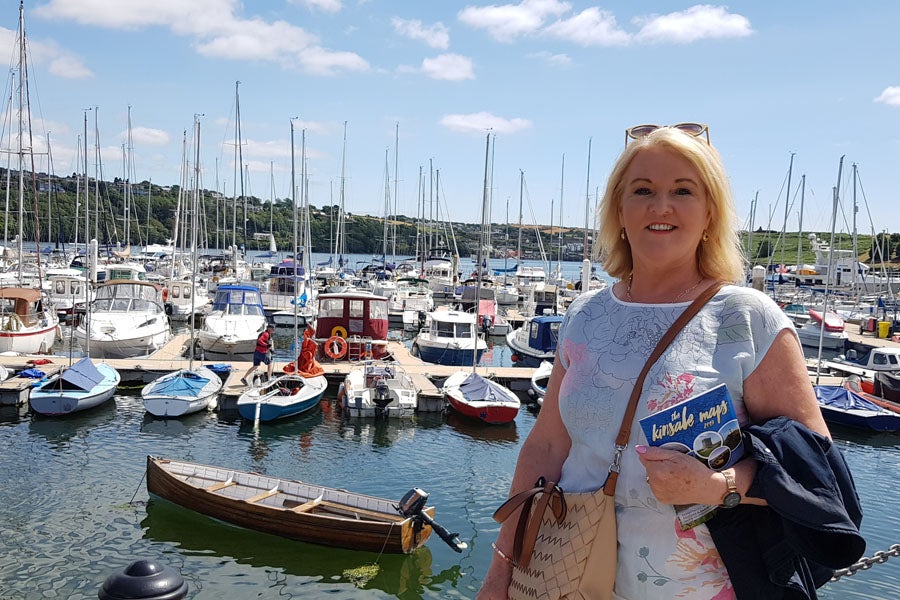 Woman in front of boats