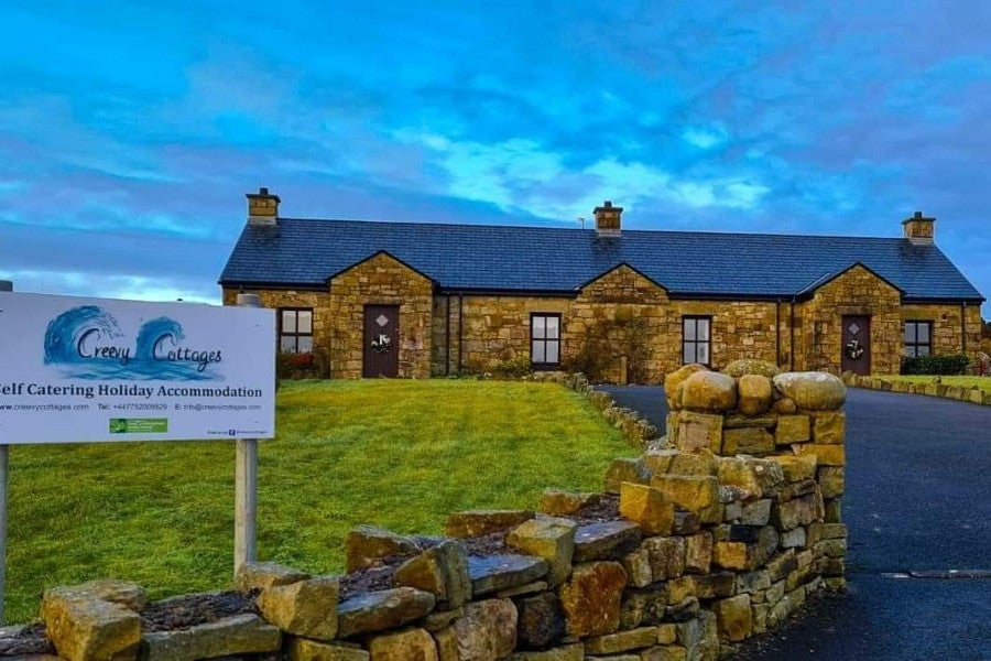 Stone house with green garden