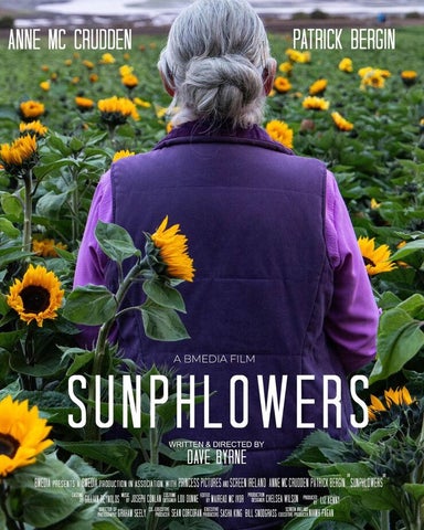 Film poster showing rear view of women in purple jacket standing in a field of sunflowers