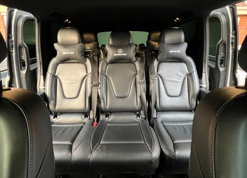 Looking at three seats in the back of a bus