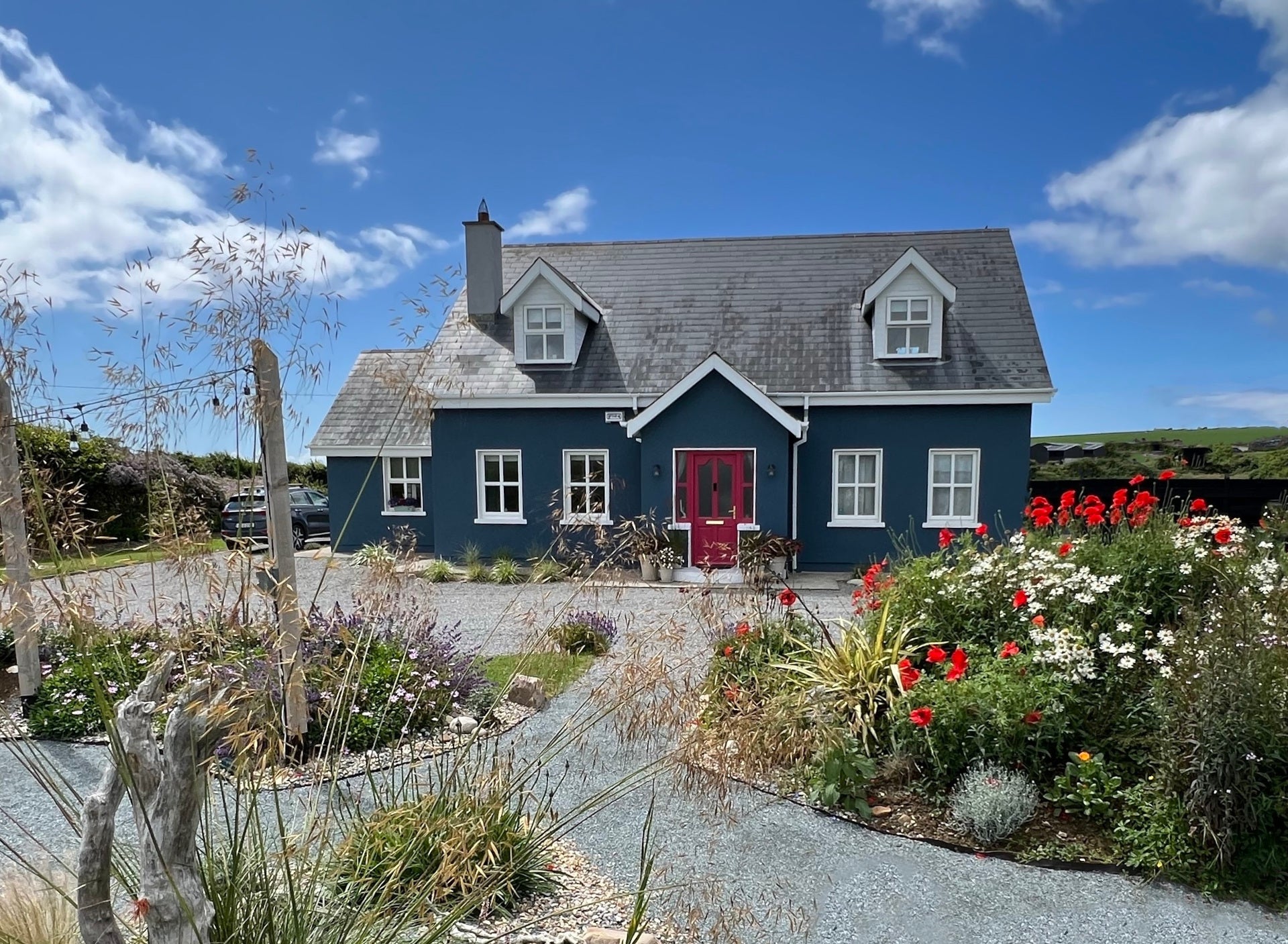 House set on a flower garden.