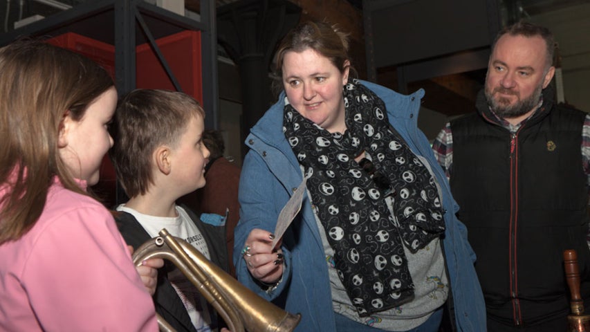 Image of a family engaging with Handling Objects