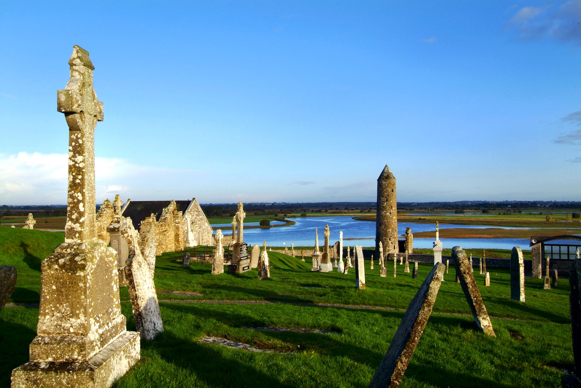 Towers and old buildings in a field at Clonmacnoise in Offaly