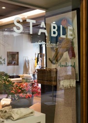 A branded window display of the Stable shop front