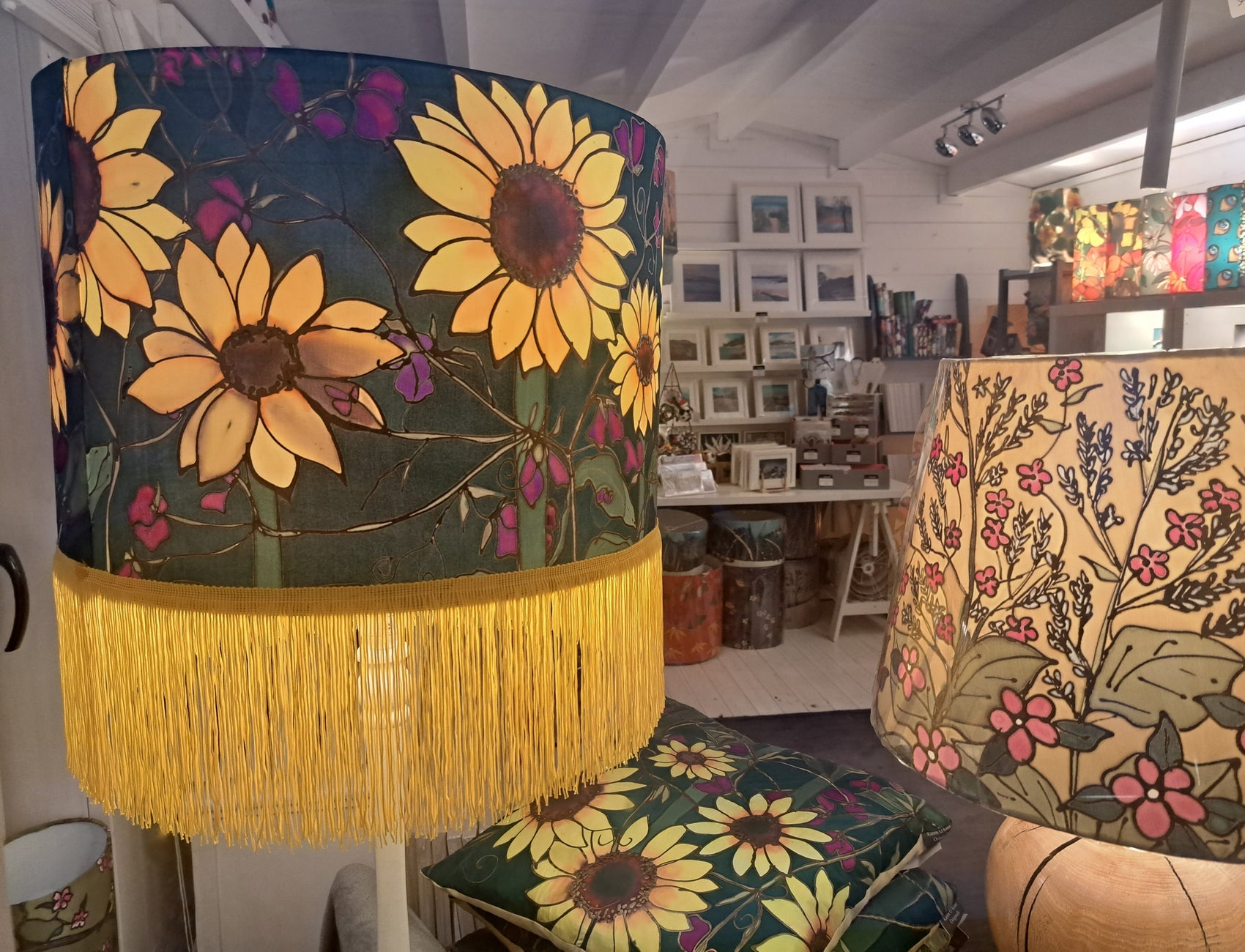 A selection of crafts with floral themes on display in a studio