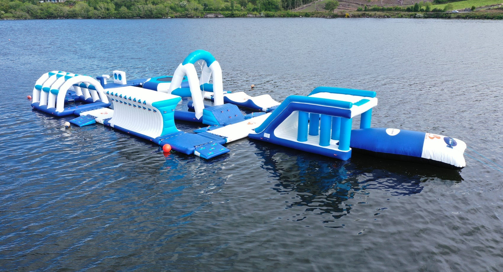 An inflatable obstacle course floating on water