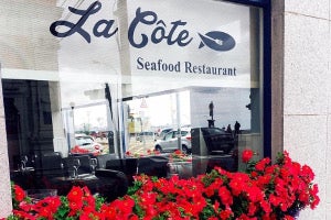 Restaurant window with red flowers