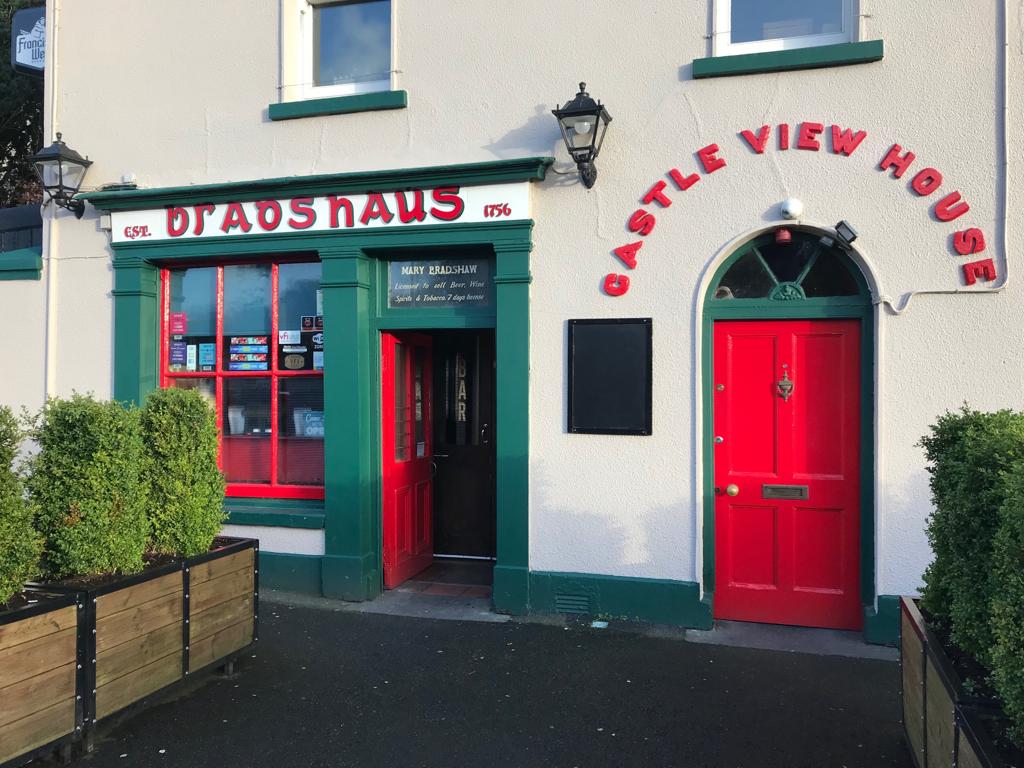 Red front door of Bradshaws Pub