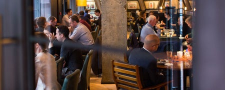 People enjoying food and drinks in the bar
