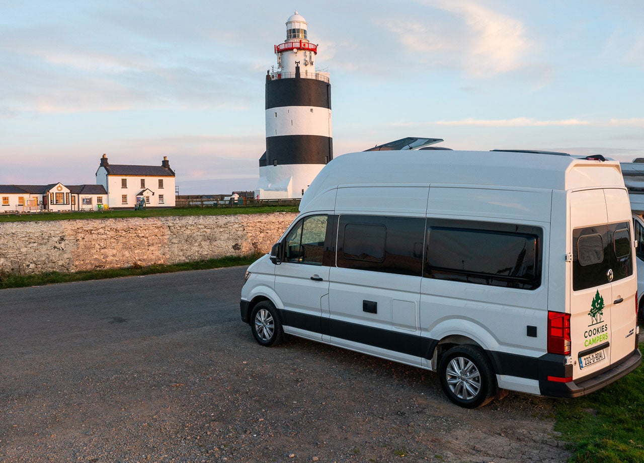 Cookies Camper parked by a lighthouse