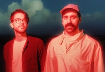 2 men side by side with orange tinted photo