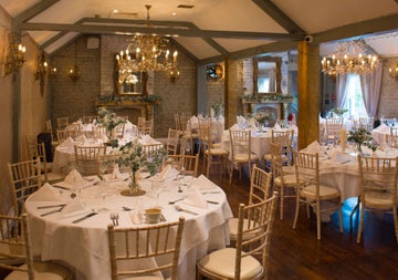 A reception room dressed for a wedding dinner at Wright's Anglers Rest
