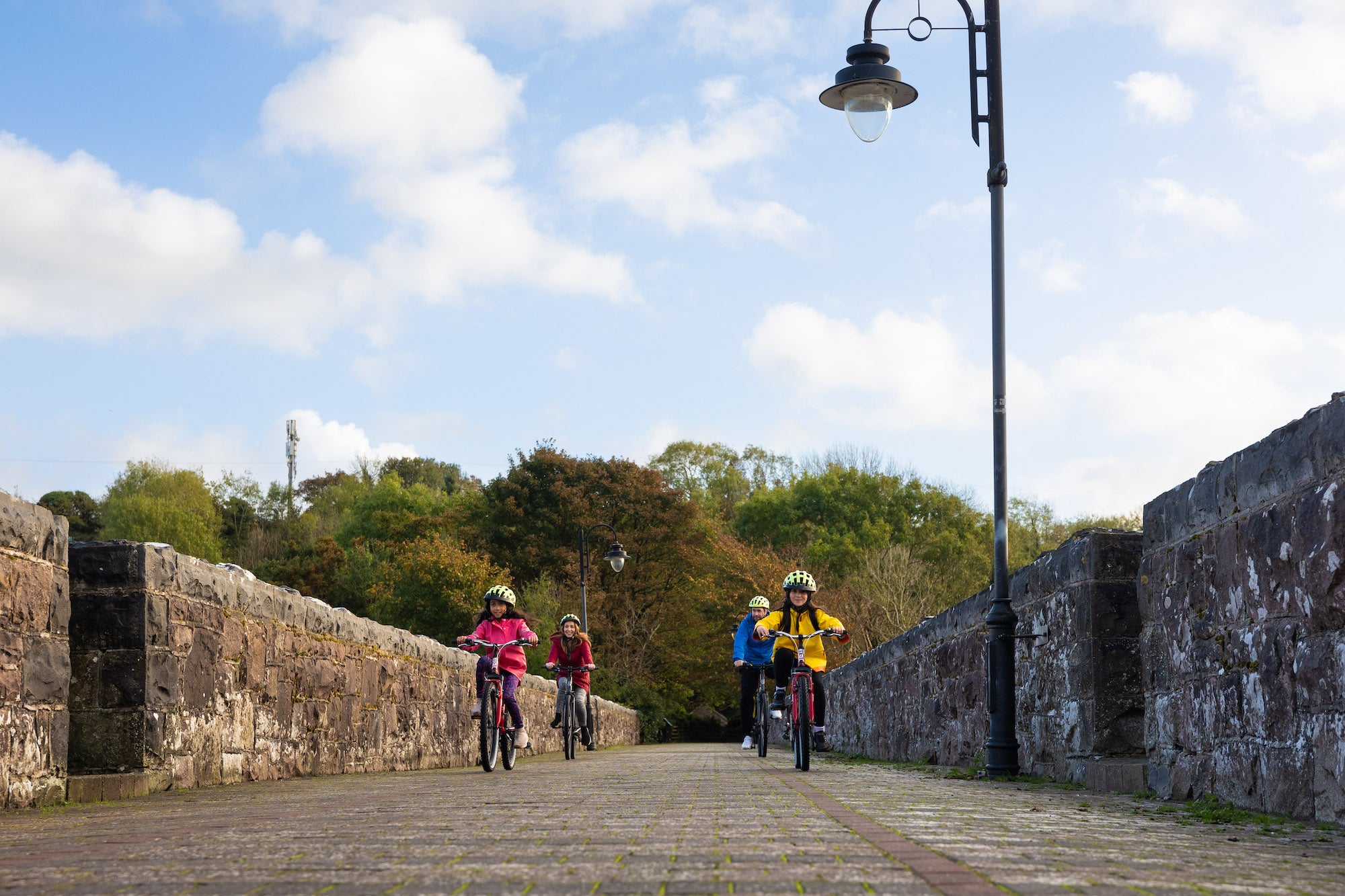 A family cycling the Great Western Greenway in Co Mayo