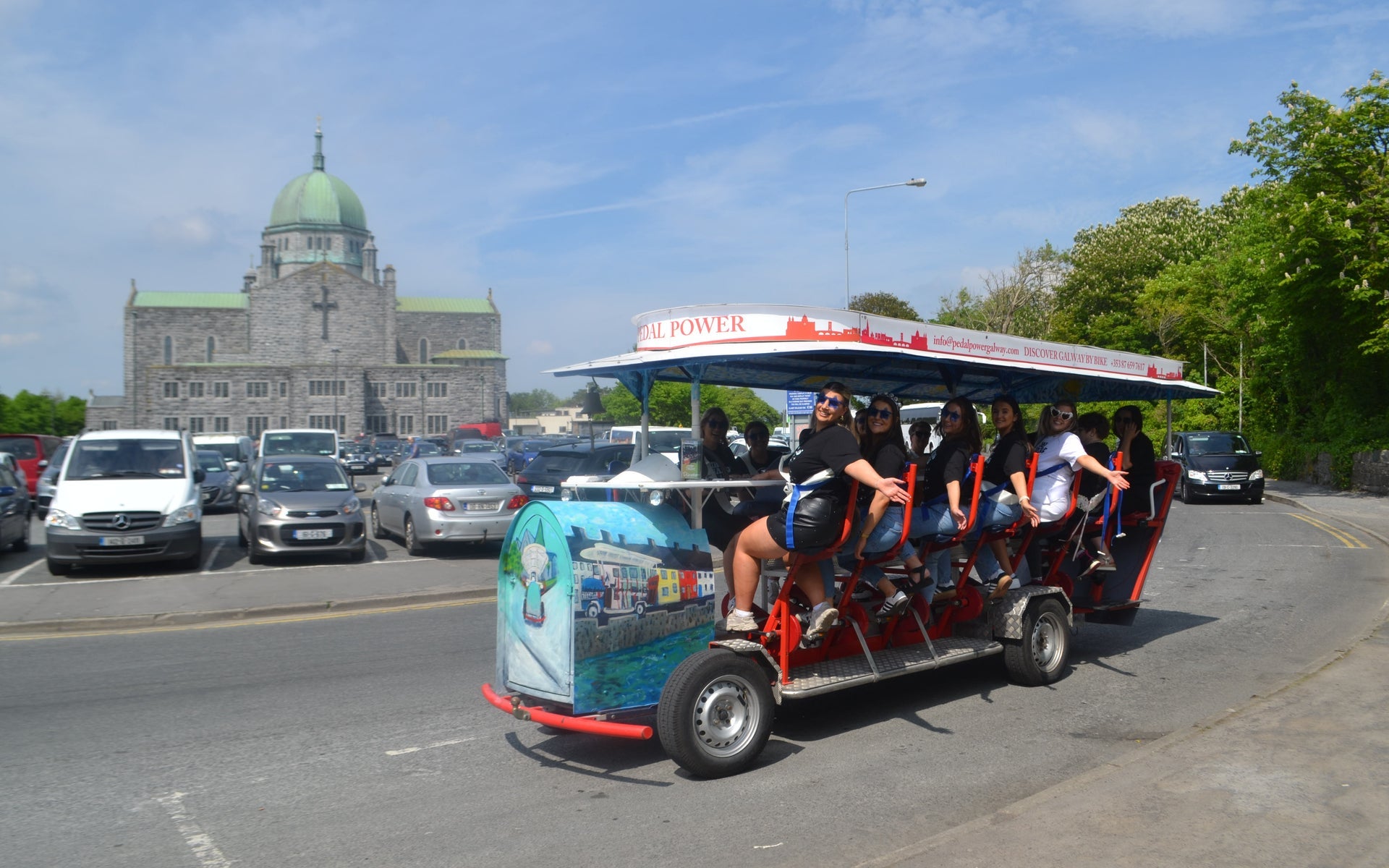 A group of ladies enjoy a tour on a pedal powered bike